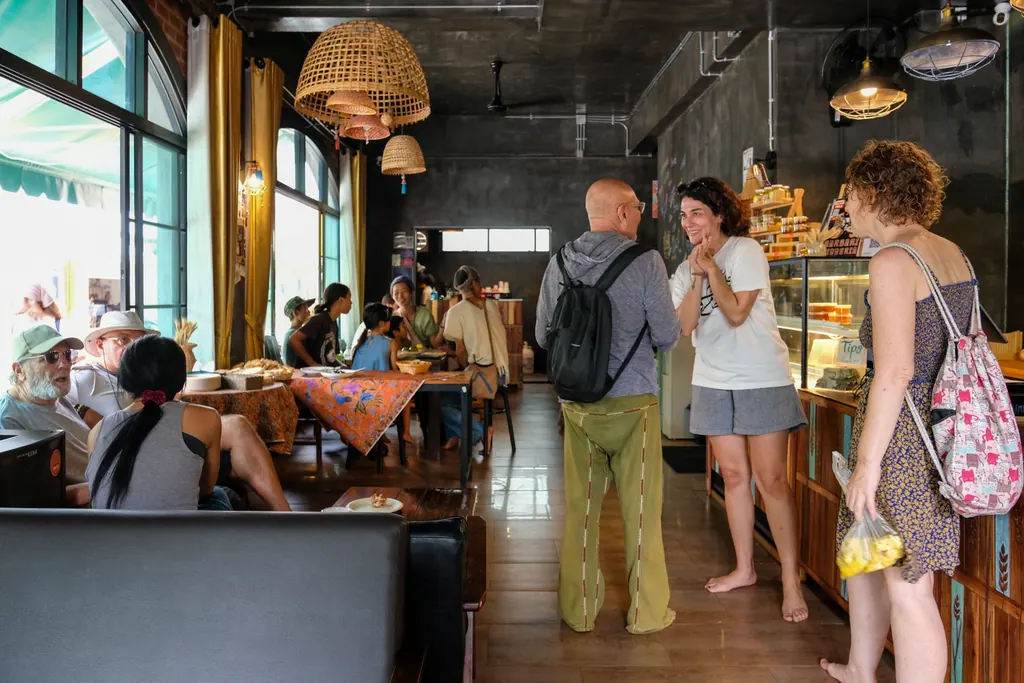 Long table and woven lamps inside the bakery